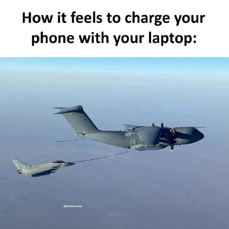 Military refuel jet fuels smaller jet mid-air, caption: How it feels to charge your phone with your laptop. #relatable #tech.